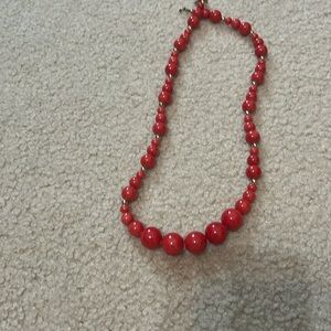 Coral and gold colored beaded necklace